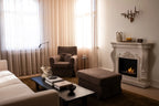 Ymir freestanding bioethanol fireplace with grey polystone surround