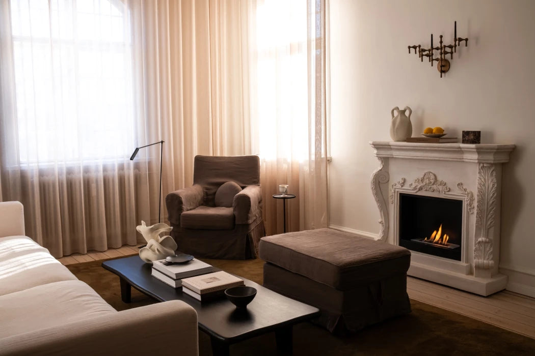 Ymir freestanding bioethanol fireplace with grey polystone surround