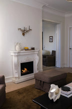 Ymir freestanding bioethanol fireplace with grey polystone surround