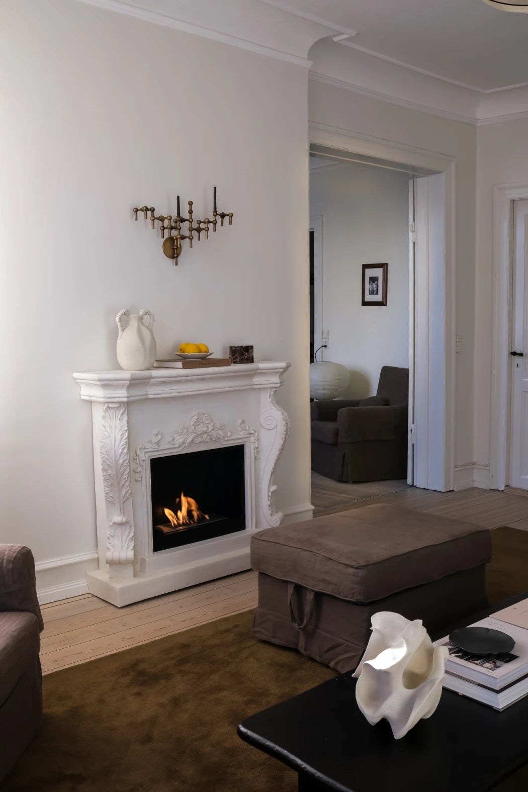 Ymir freestanding bioethanol fireplace with grey polystone surround