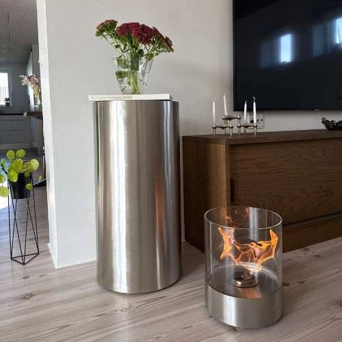 ScandiFlames Dualis bioethanol fireplace with a brushed steel fireplace body and a cylindrical safety glass