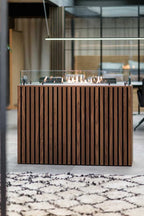 Foco Four 800 built-in bioethanol fireplace with black steel frame, tempered glass panels, and a vibrant flame display