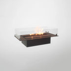 Foco Four 800 built-in bioethanol fireplace with black steel frame, tempered glass panels, and a vibrant flame display