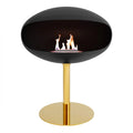 Pedestal bioethanol fireplace in black with brass base